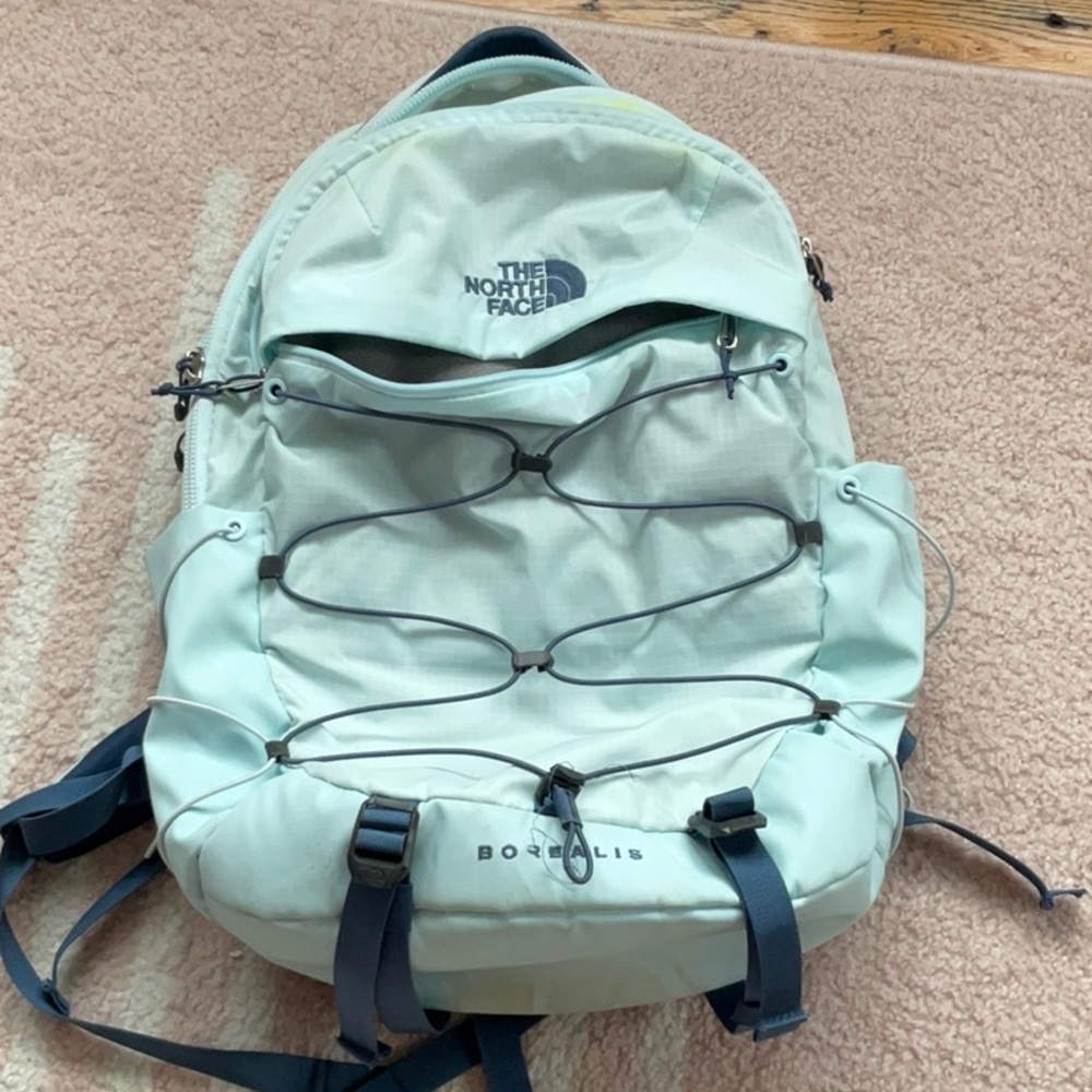 light blue and navy blue north face backpack